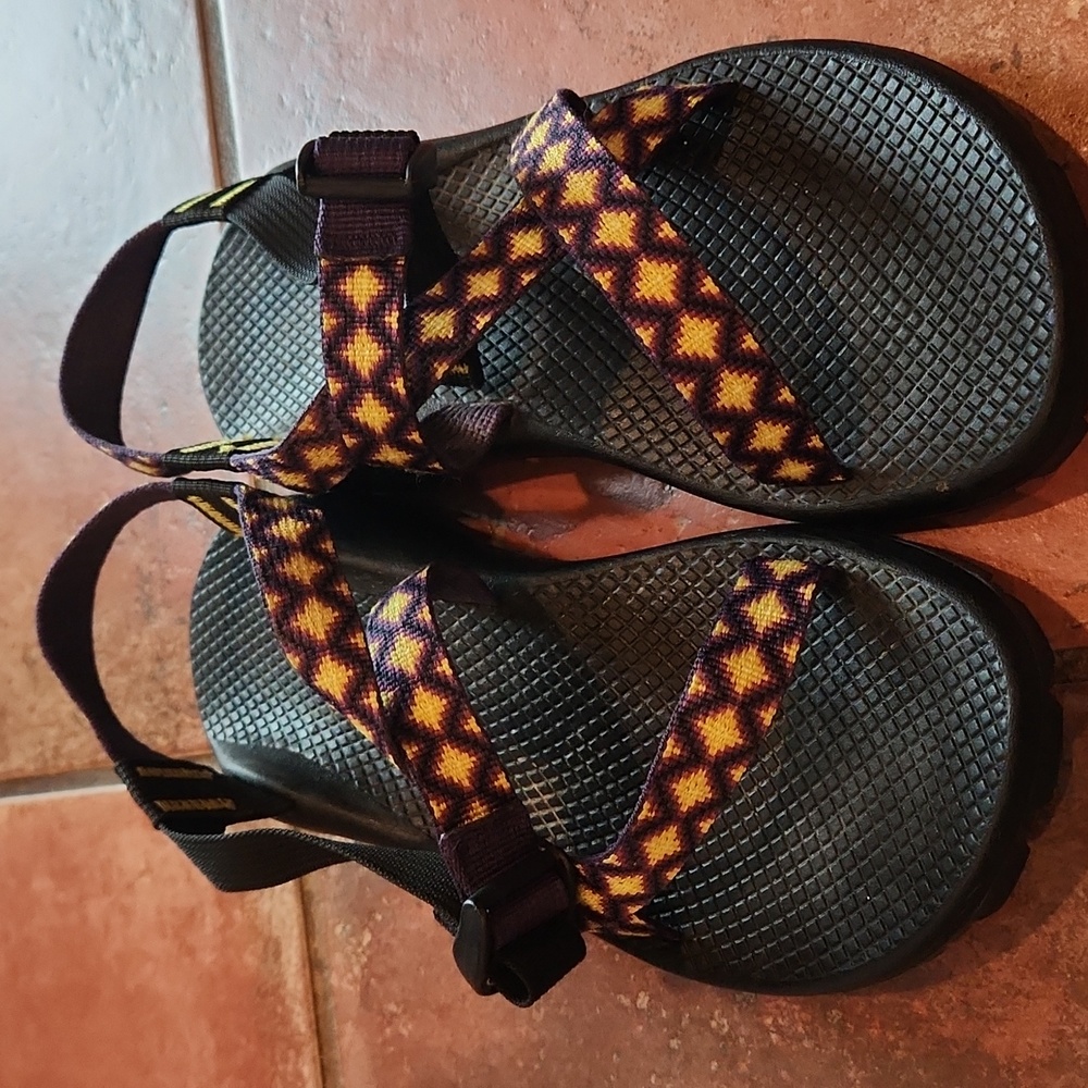 Yellow and Purple Chaco Sandles are in great condition.